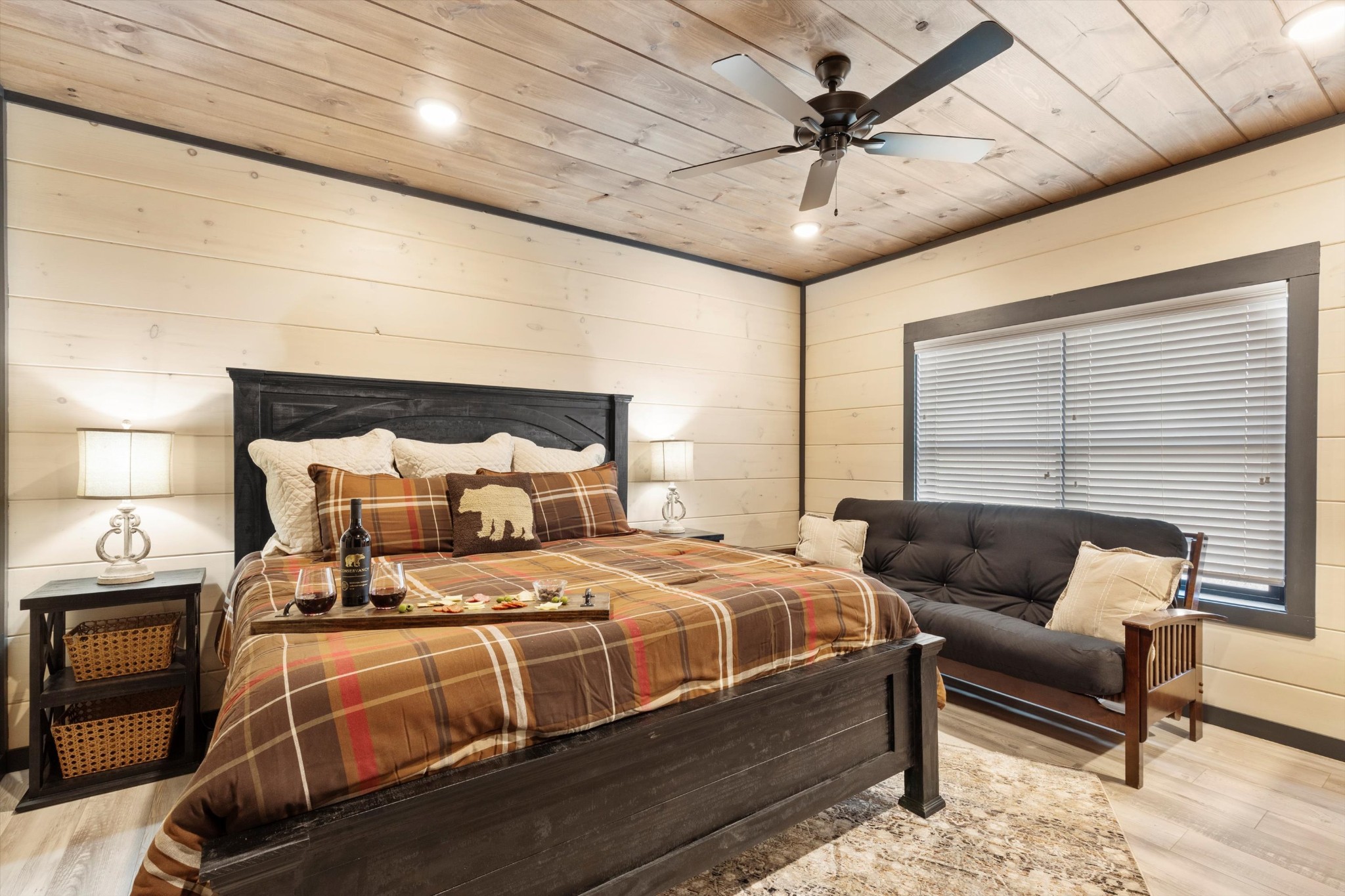 320 Rambling Creek Way Sevierville, TN 37862 - Photo 33 of 65 a bedroom with a bed a couch and a chandelier