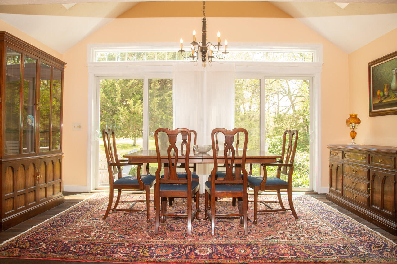 21 Midpine Road Cummaquid, MA 02675 - Photo 11 of 32 a view of a dining room with furniture window and wooden floor