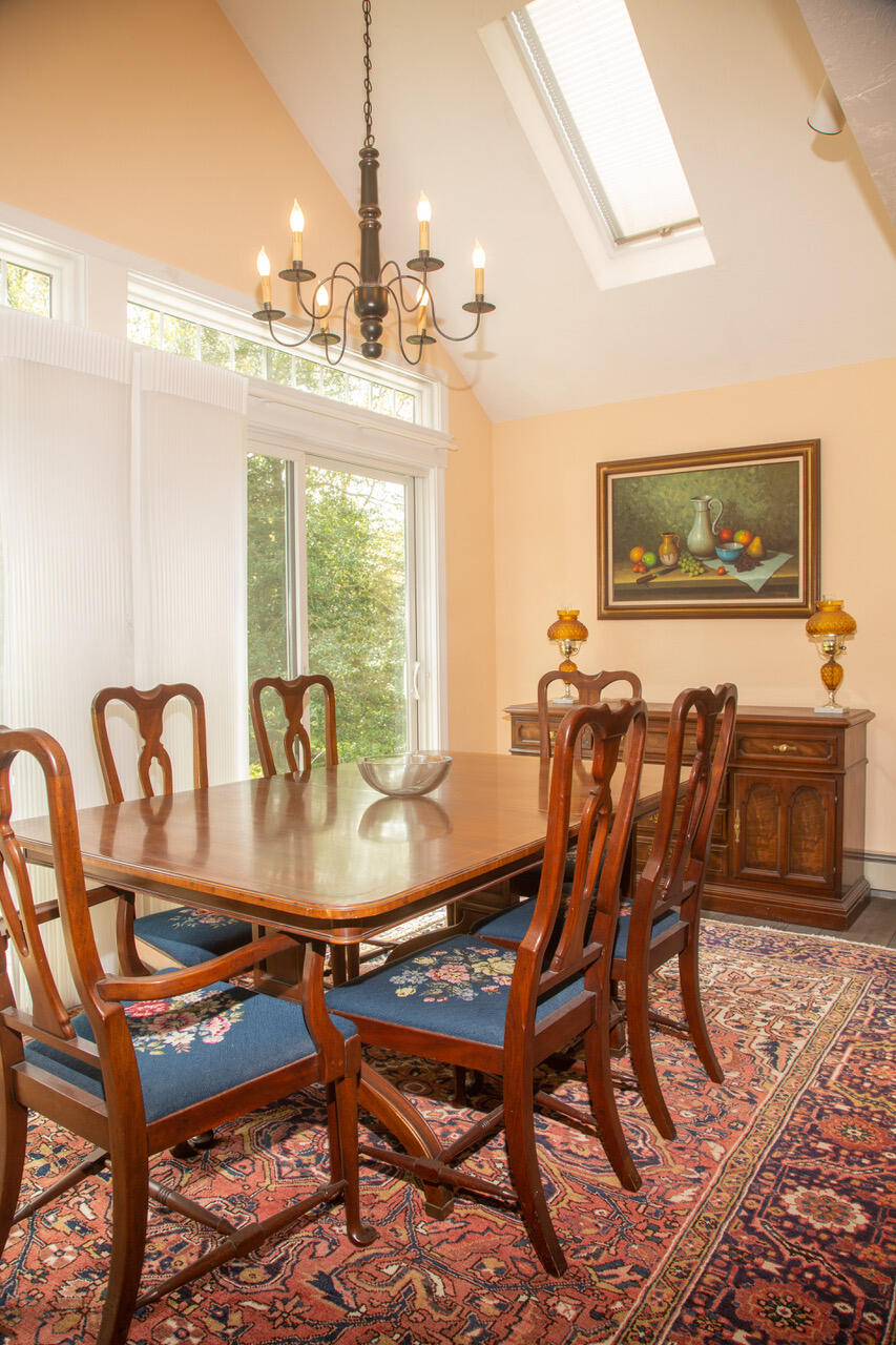 21 Midpine Road Cummaquid, MA 02675 - Photo 12 of 32 a view of a dining room with furniture window and outside view