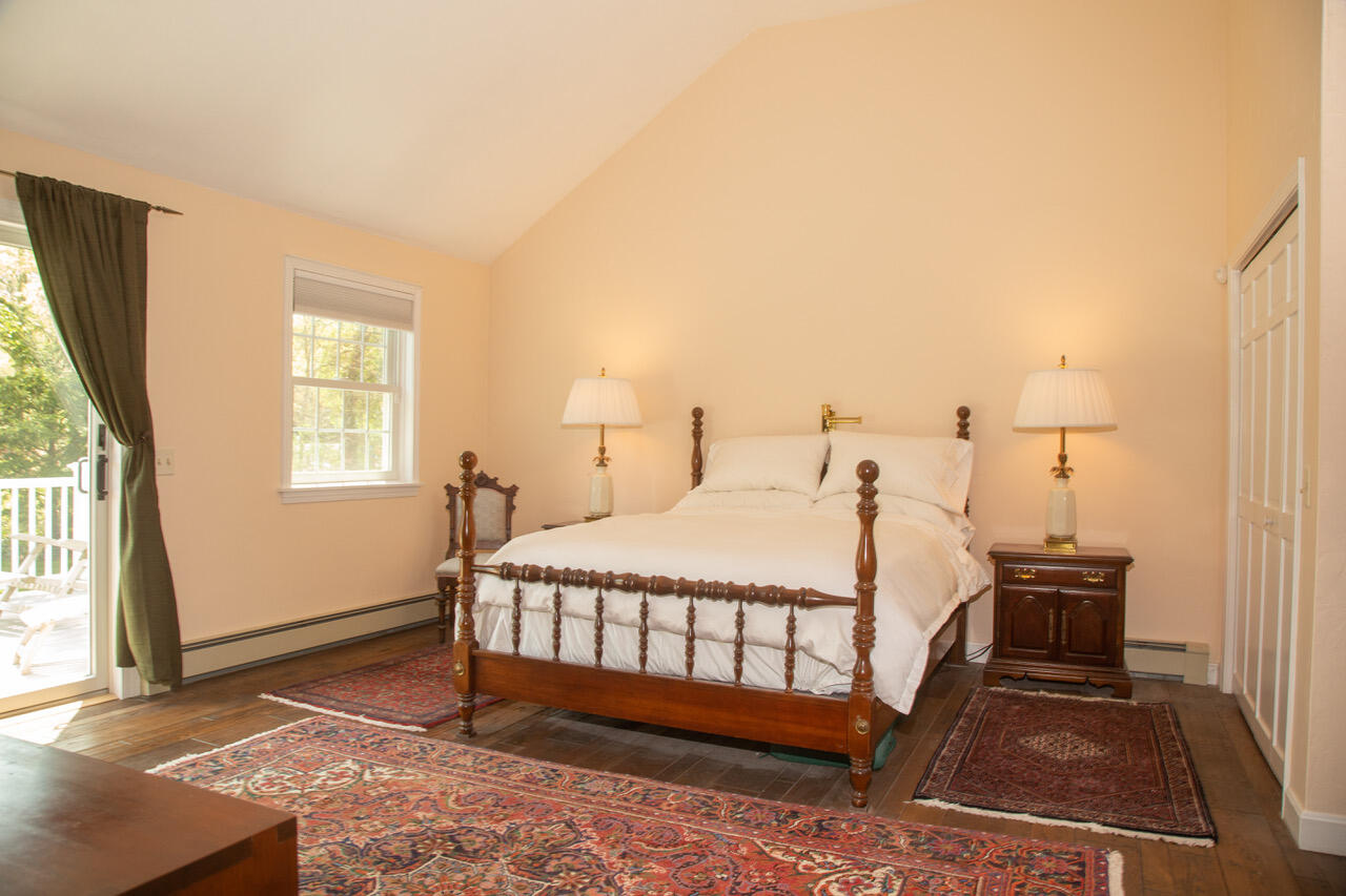 21 Midpine Road Cummaquid, MA 02675 - Photo 18 of 32 a bed sitting in a bedroom next to a window