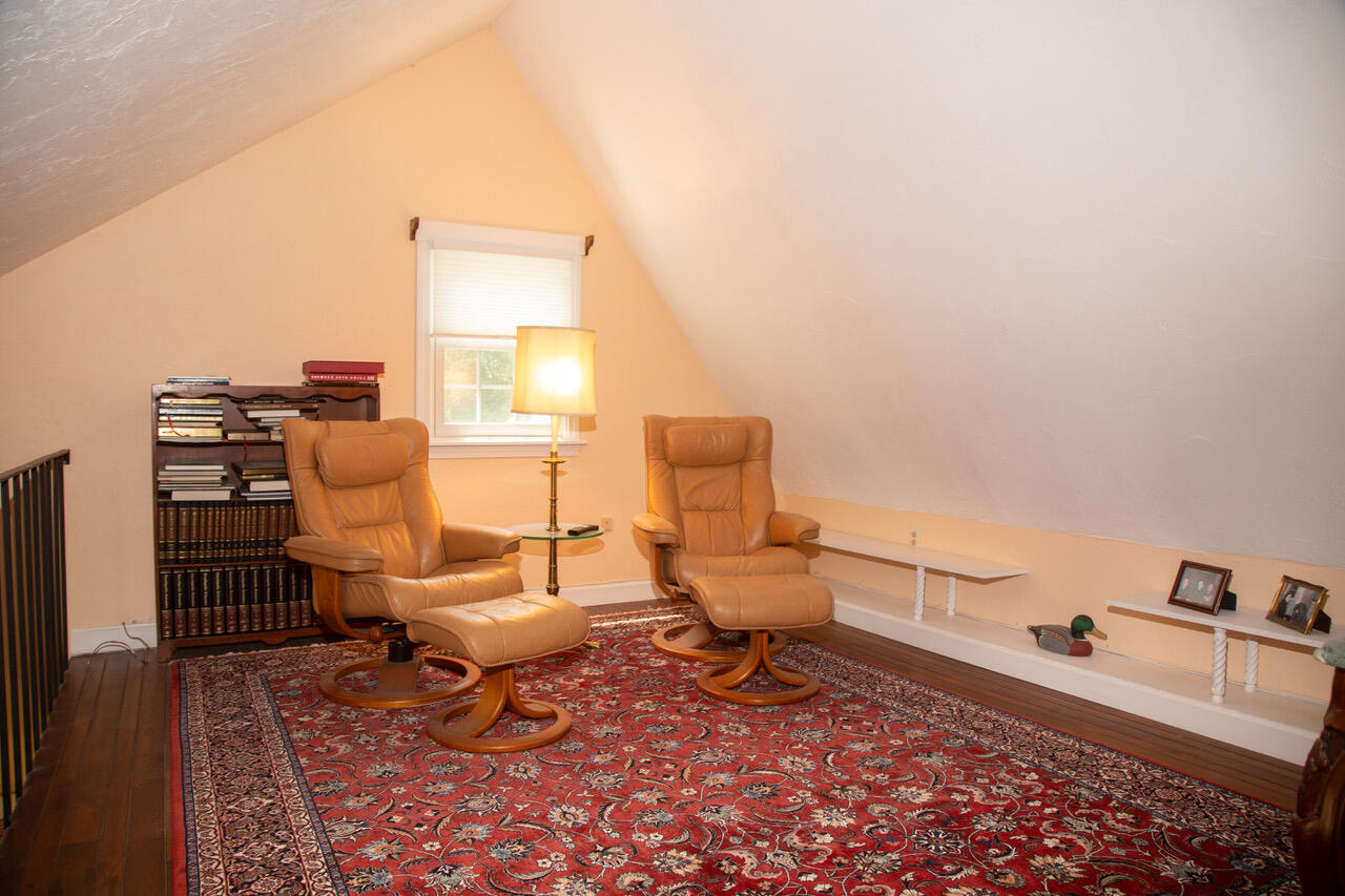 21 Midpine Road Cummaquid, MA 02675 - Photo 24 of 32 a living room with furniture and a floor to ceiling window