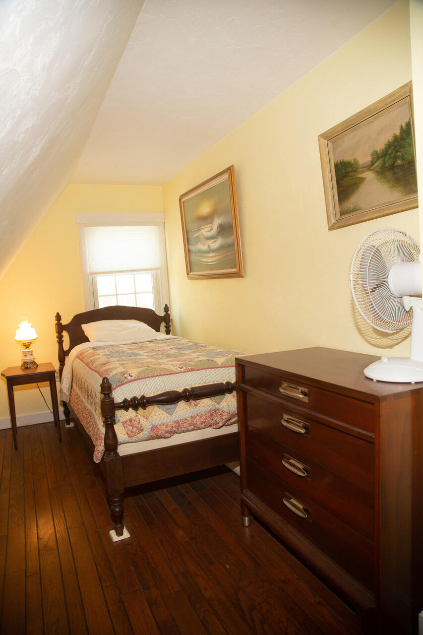 21 Midpine Road Cummaquid, MA 02675 - Photo 26 of 32 a bedroom with a bed and painting on the wall