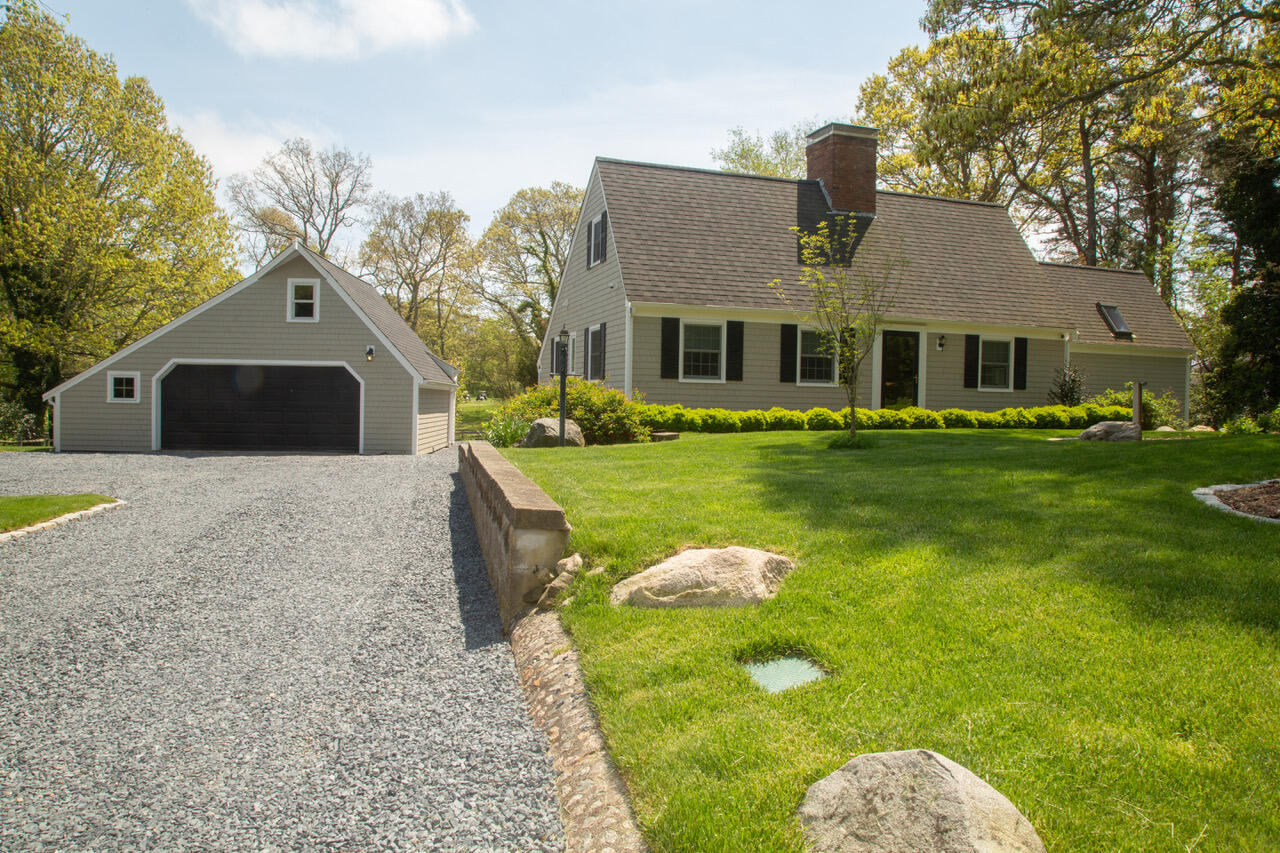 21 Midpine Road Cummaquid, MA 02675 - Photo 3 of 32 a front view of a house with garden