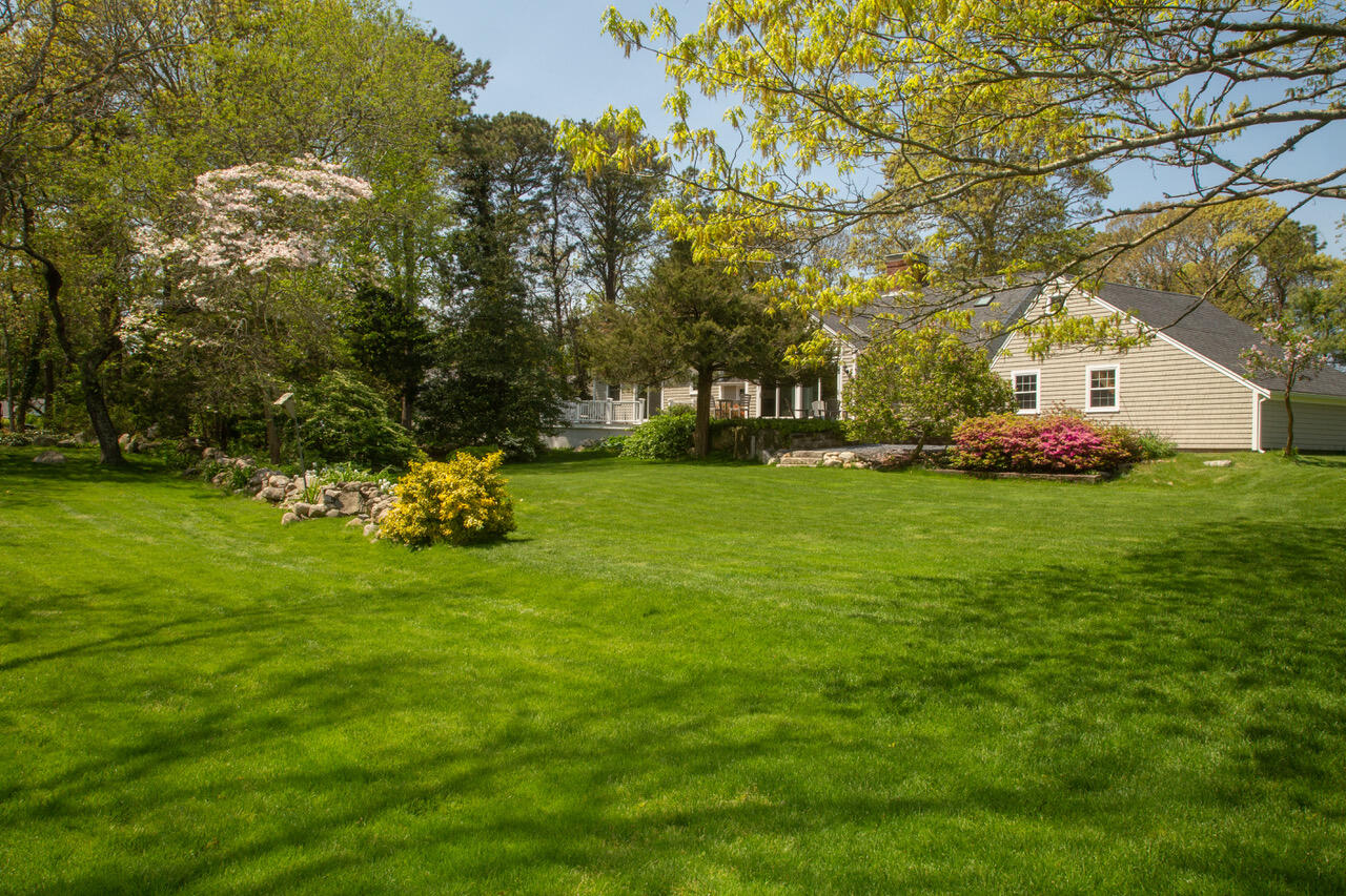 21 Midpine Road Cummaquid, MA 02675 - Photo 5 of 32 a view of a tree in front of a house