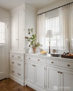 a kitchen with cabinets appliances and a window