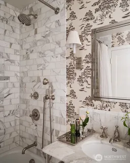 a bathroom with a shower and a sink