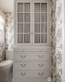 a bathroom with a toilet and a window