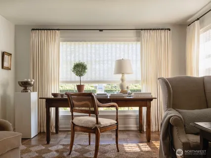 a view of a livingroom with furniture and window
