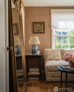 a living room with furniture and a window