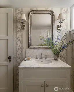 a bathroom with a sink a mirror and a shower