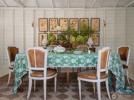 a dining room with furniture and window