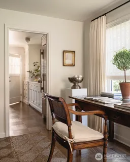 a dining room with furniture and window