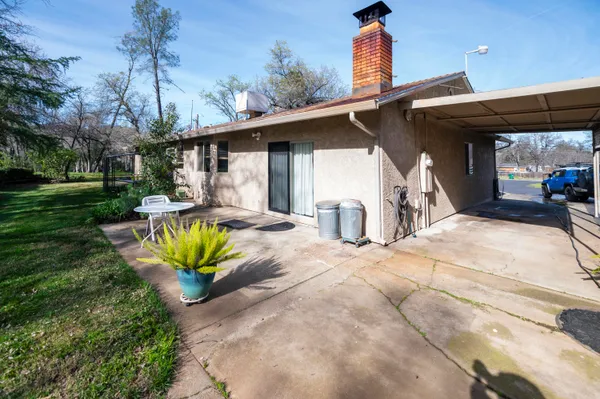 a house view with a backyard space