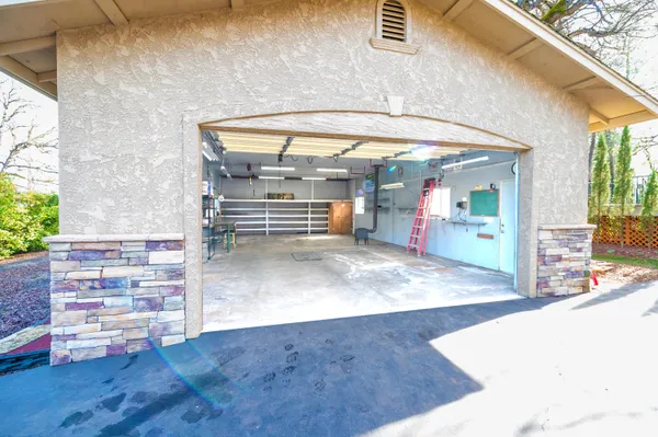a view of a room with wooden floor and windows