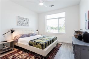 13130 Pond Springs Road, Unit 3214 Austin, TX 78729 - Photo 34 of 40 Natural light floods this spacious sleeping area, offering a tranquil retreat.