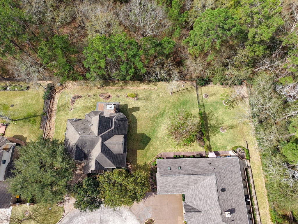901 Longmire Road, Unit 28 Conroe, TX 77304 - Photo 13 of 31 an aerial view of a house with outdoor space