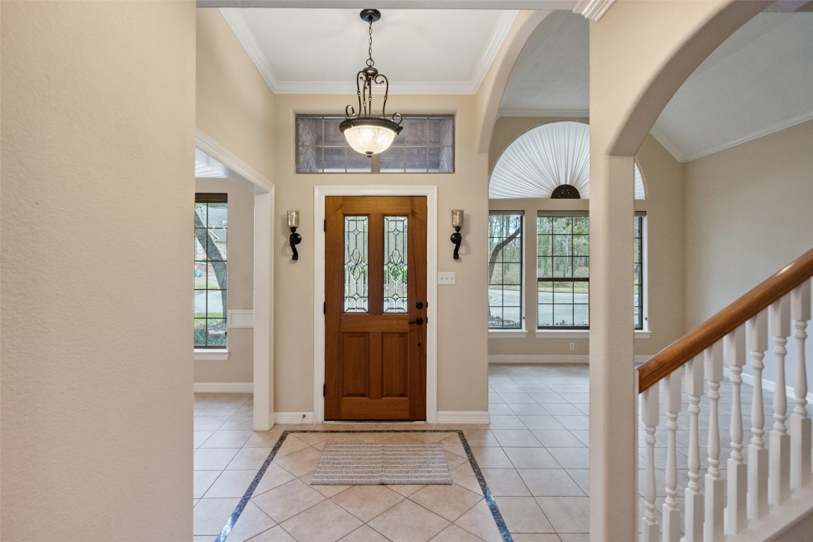 901 Longmire Road, Unit 28 Conroe, TX 77304 - Photo 2 of 31 a view of an entryway with a window