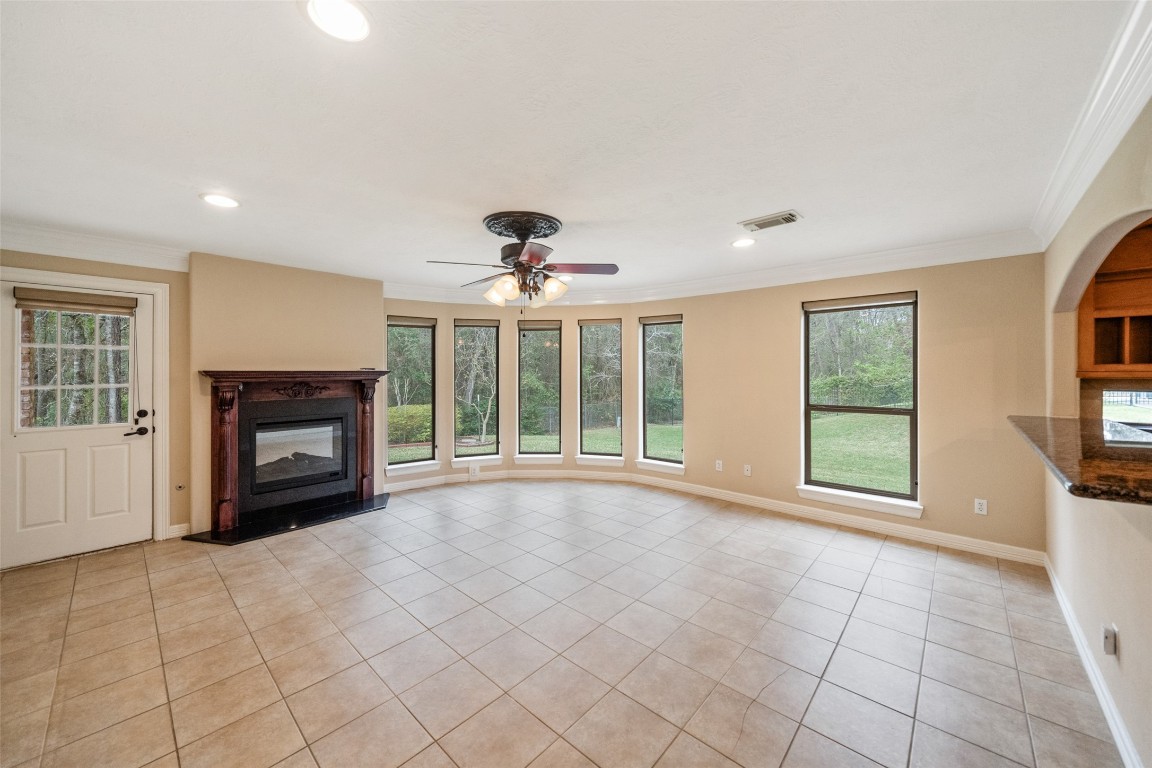 901 Longmire Road, Unit 28 Conroe, TX 77304 - Photo 20 of 31 a view of an empty room with a fireplace and a window