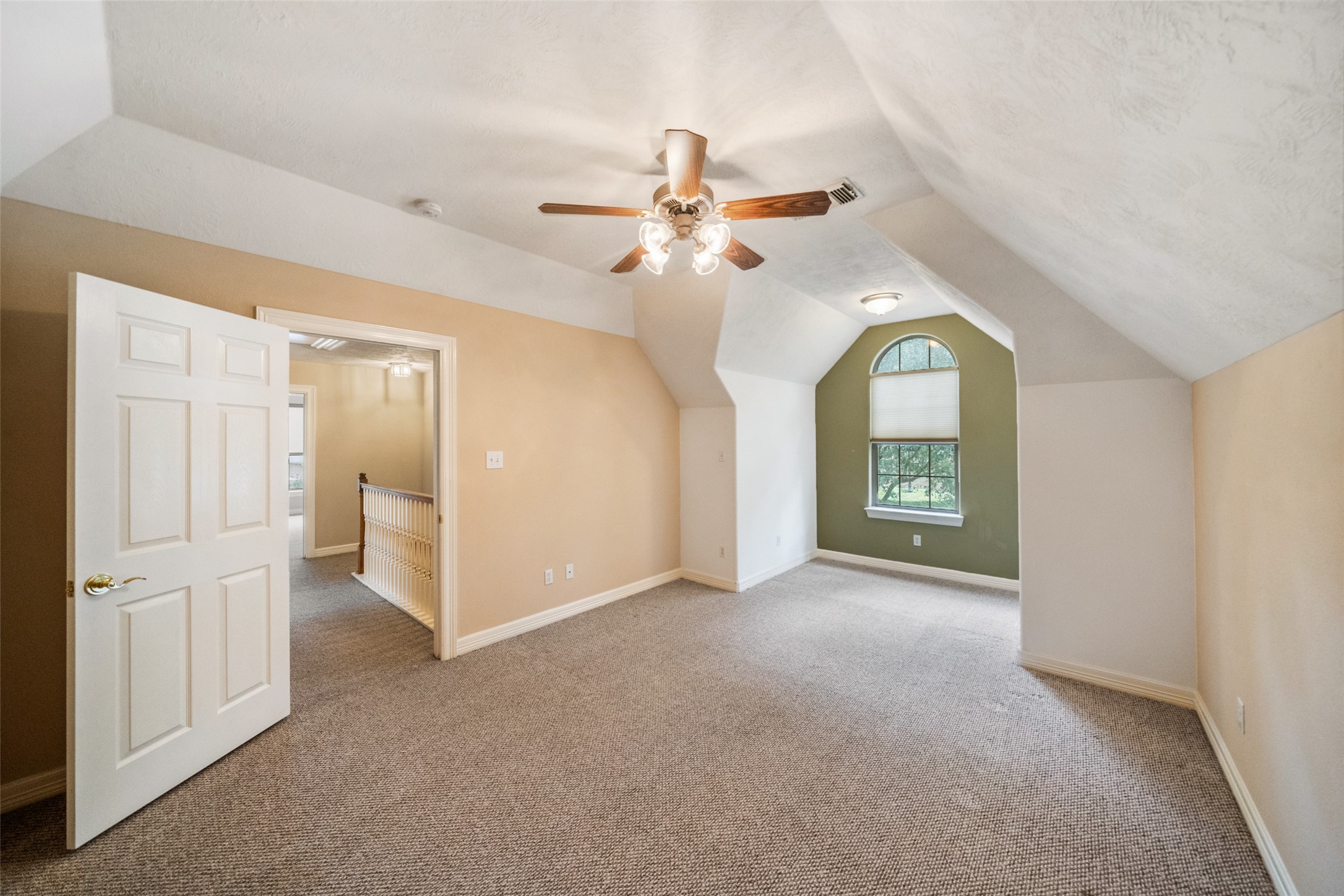 901 Longmire Road, Unit 28 Conroe, TX 77304 - Photo 27 of 31 wooden floor in an empty room with a window