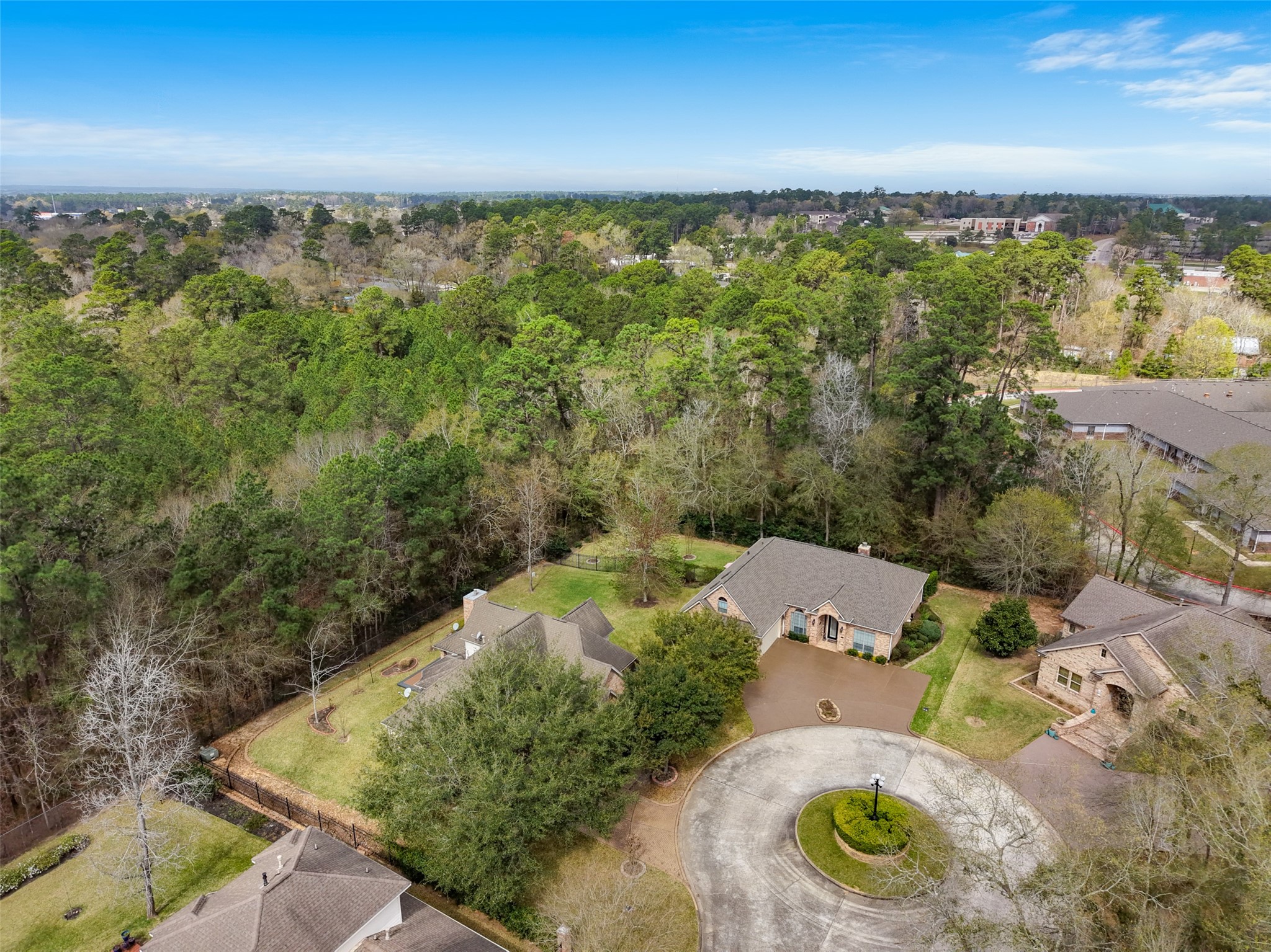 901 Longmire Road, Unit 28 Conroe, TX 77304 - Photo 29 of 31 an aerial view of residential house with outdoor space