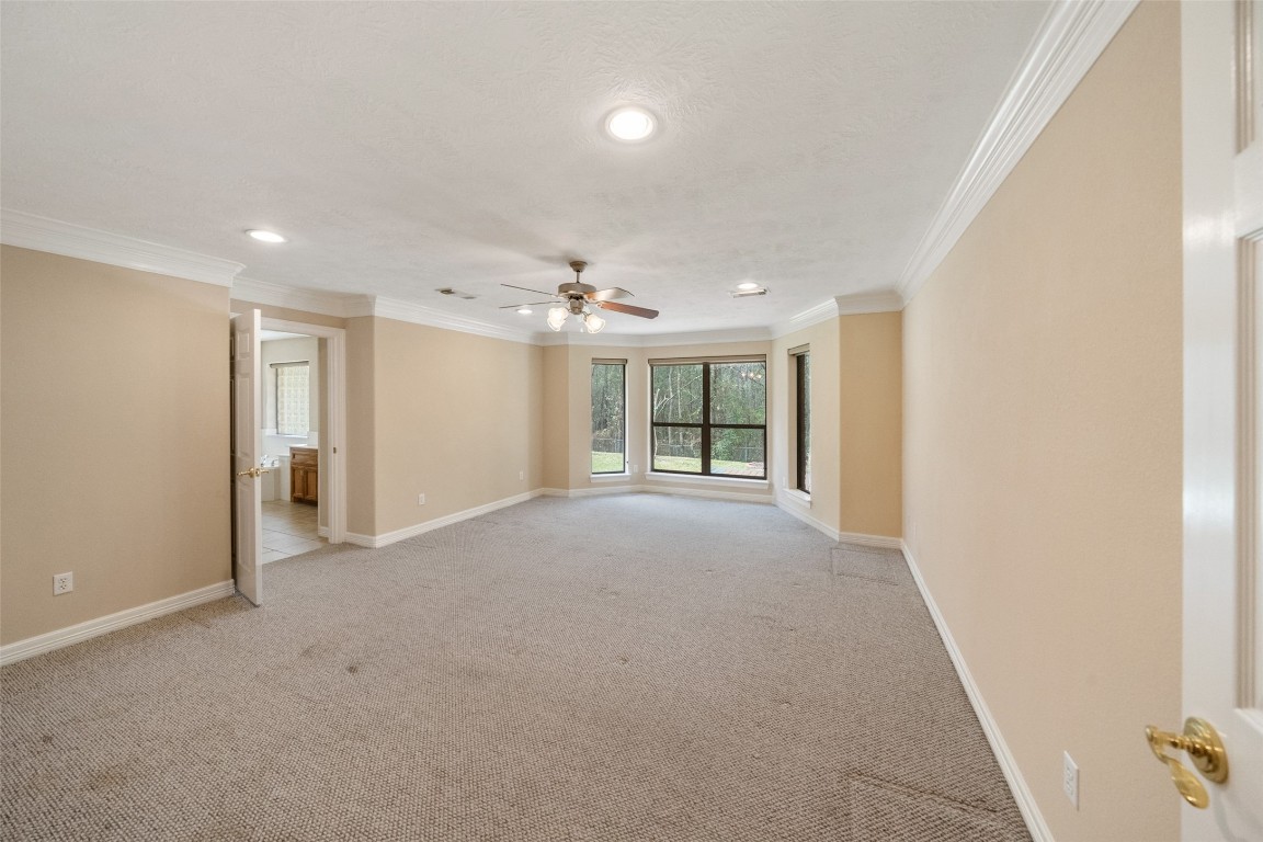 901 Longmire Road, Unit 28 Conroe, TX 77304 - Photo 10 of 31 a view of an empty room with a window