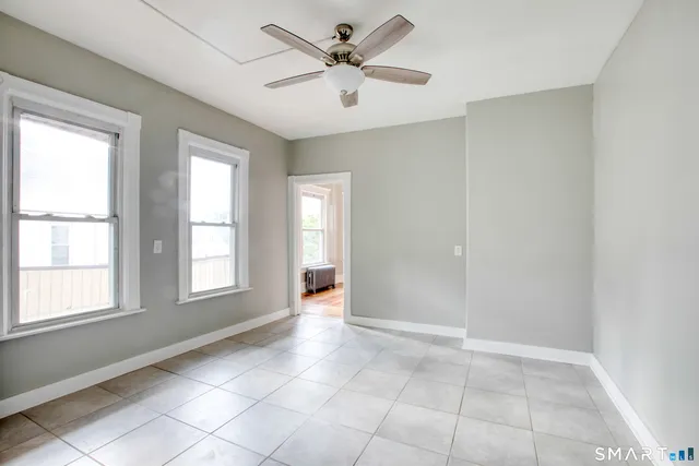a view of an empty room with a window