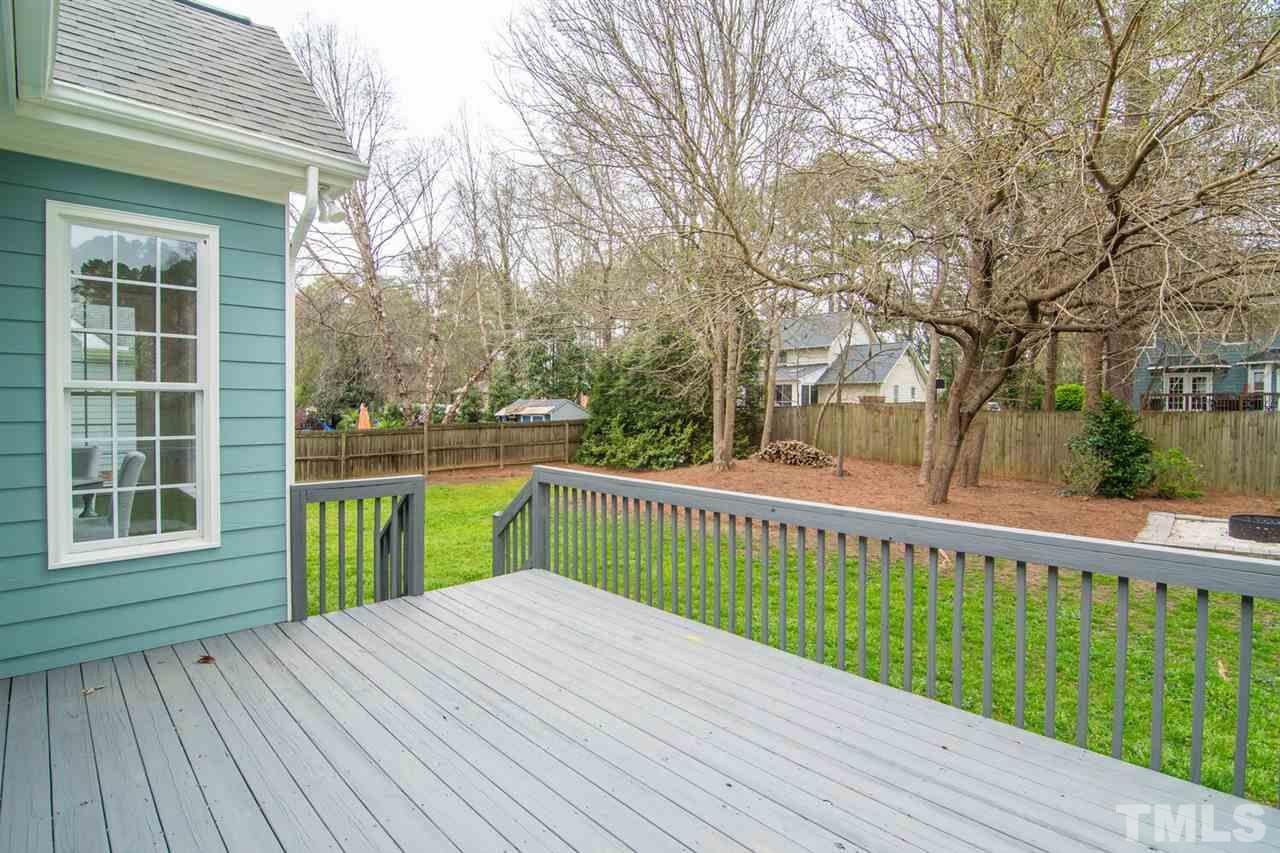 1614 Weatherford Circle Raleigh, NC 27604 - Photo 10 of 12 The deck has lots of space for enjoying the nicely landscaped yard and there's a FIRE PIT too! Nice flat yard -plenty of space for kids or pets to play!