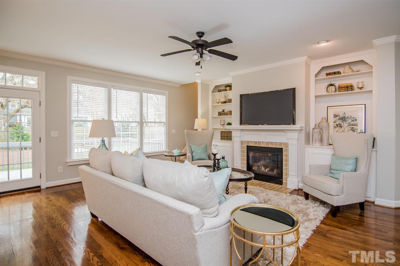 1614 Weatherford Circle Raleigh, NC 27604 - Photo 2 of 12 The family room gets a ton of NATURAL LIGHT! Nice FIREPLACE for those chilly evenings and lots of shelving to display your favorite photos and collectibles.