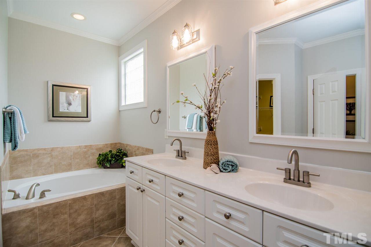 1614 Weatherford Circle Raleigh, NC 27604 - Photo 5 of 12 Garden tub, dual vanities, TILE flooring and a water closet. Everything you want in your owners bath.