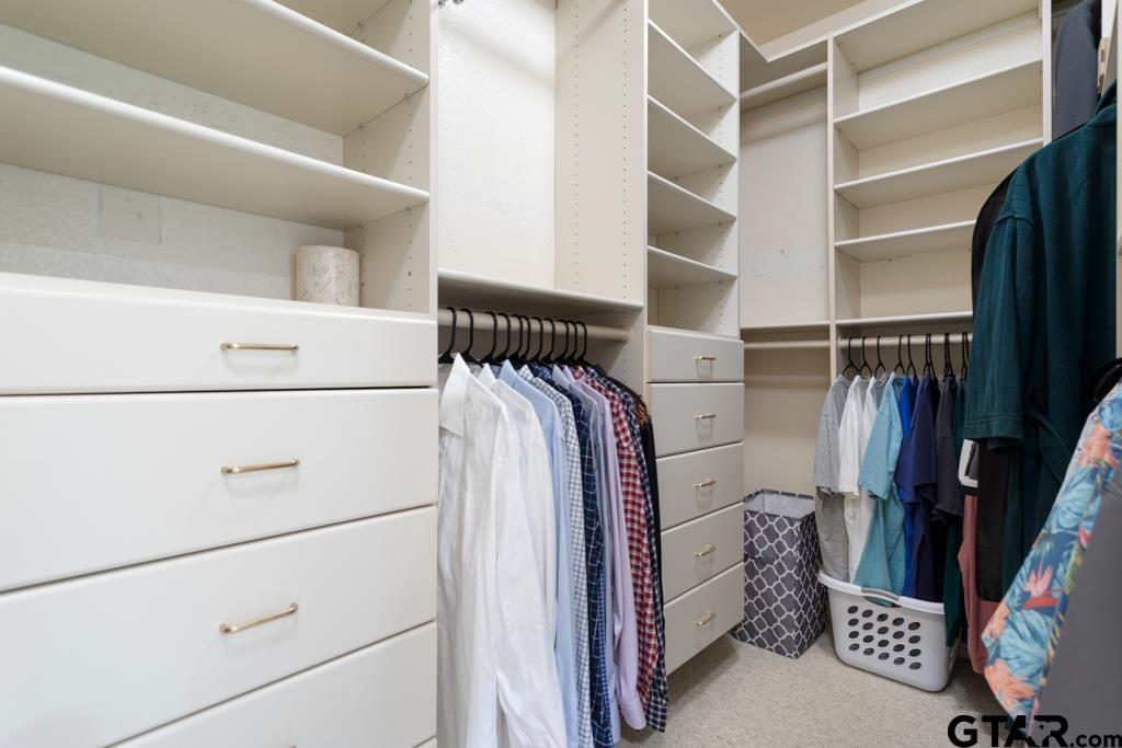 4608 North O'Connor Road Irving, TX 75062 - Photo 26 of 45 a view of walk in closet with clothes and shoes