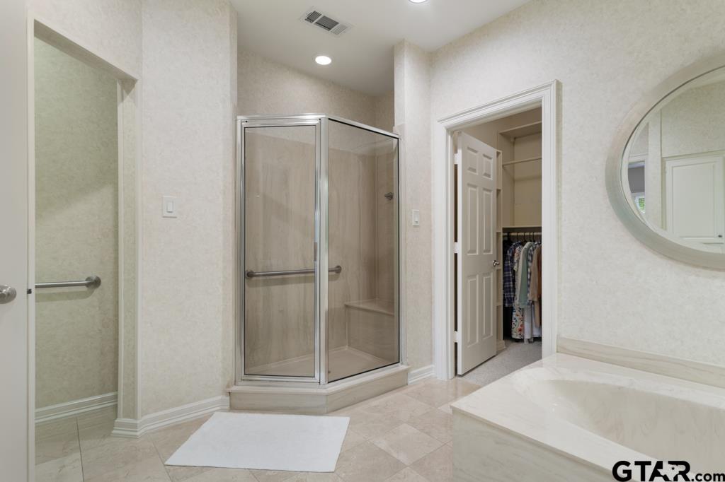 4608 North O'Connor Road Irving, TX 75062 - Photo 29 of 45 a bathroom with a glass shower door and a sink