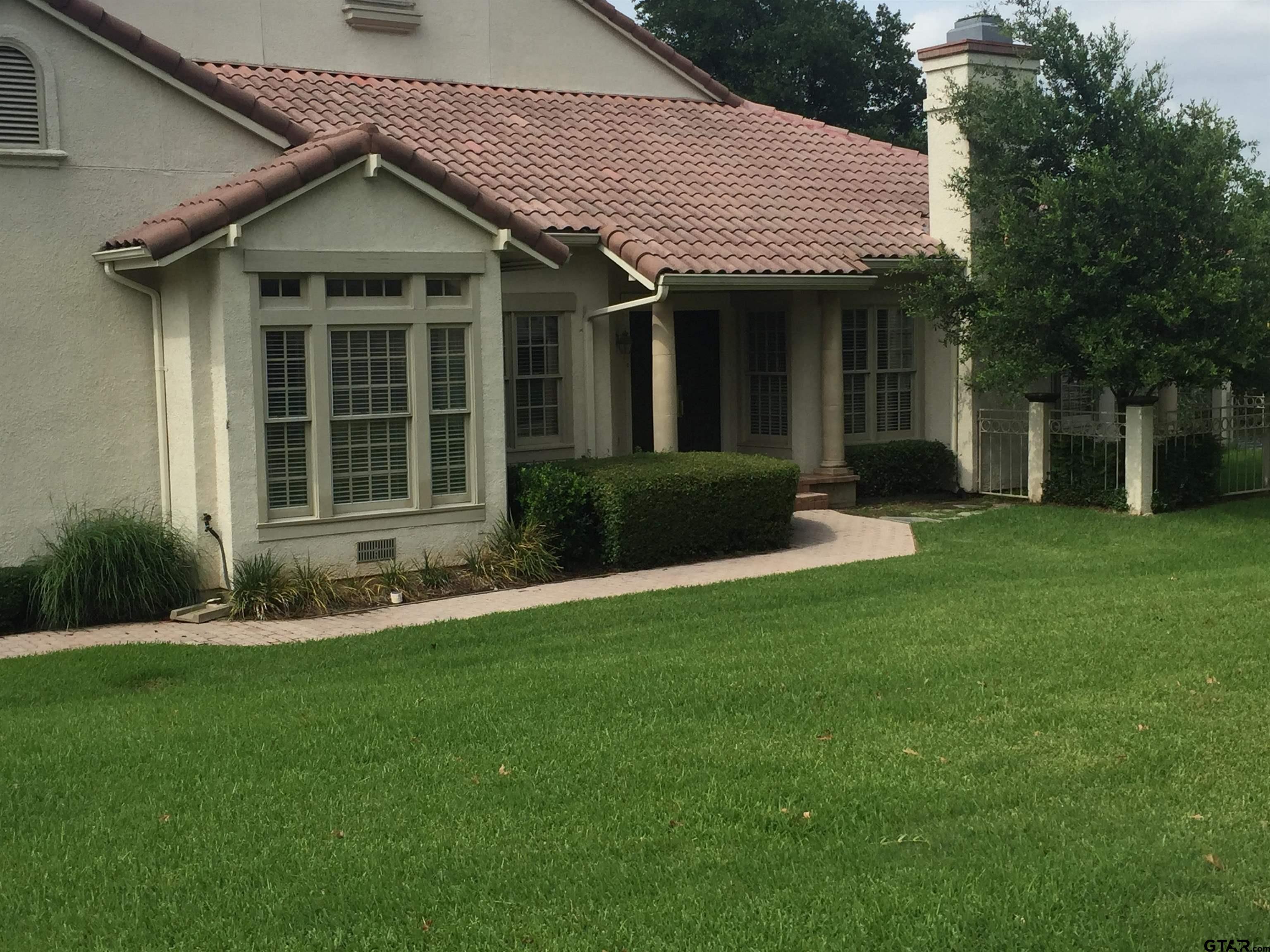 4608 North O'Connor Road Irving, TX 75062 - Photo 4 of 45 a front view of a house with a yard and porch