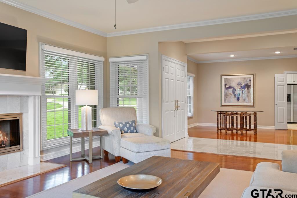 4608 North O'Connor Road Irving, TX 75062 - Photo 9 of 45 a living room with furniture and a flat screen tv