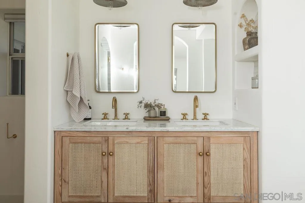 24385 Fuerte Road Temecula, CA 92590 - Photo 20 of 72 a bathroom with double vanity sinks and a mirror