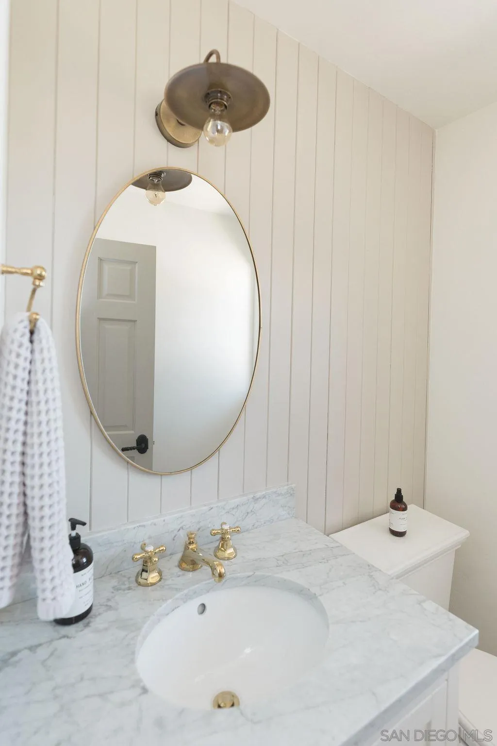 24385 Fuerte Road Temecula, CA 92590 - Photo 38 of 72 a bathroom with a sink and a mirror
