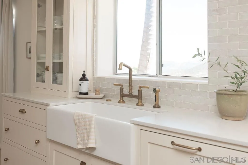 24385 Fuerte Road Temecula, CA 92590 - Photo 6 of 72 a bathroom with a sink and a window