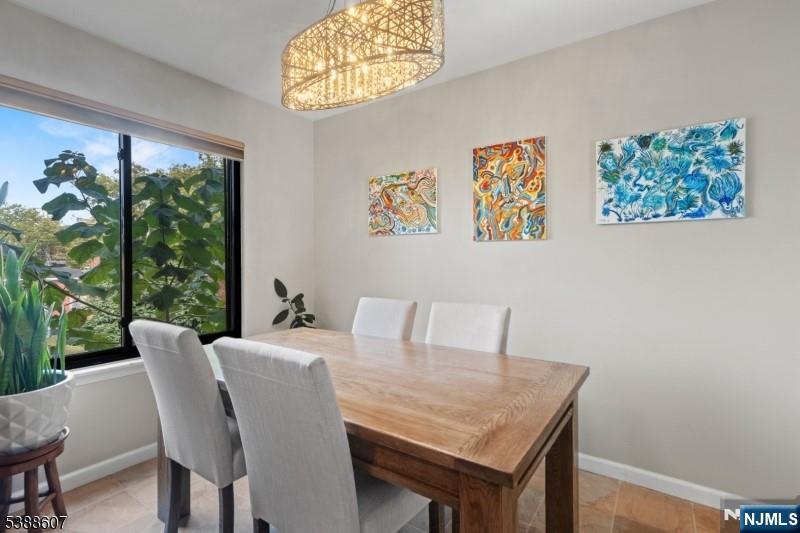 404-406 Chestnut Street Newark, NJ 07105 - Photo 17 of 27 a view of a dining room with furniture large window and outside view