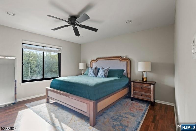 404-406 Chestnut Street Newark, NJ 07105 - Photo 20 of 27 a bedroom with a bed and window