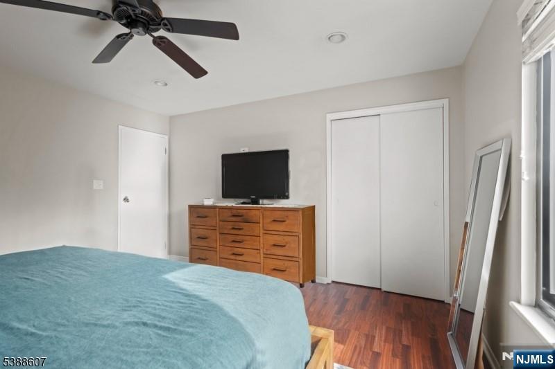 404-406 Chestnut Street Newark, NJ 07105 - Photo 21 of 27 a bedroom with a bed and a flat screen tv