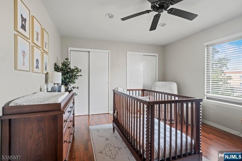404-406 Chestnut Street Newark, NJ 07105 - Photo 23 of 27 a bedroom with a bed and a chandelier