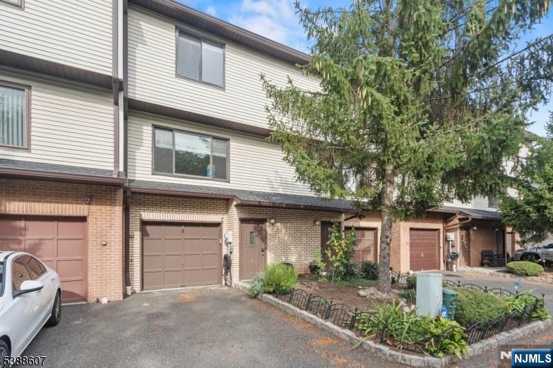 404-406 Chestnut Street Newark, NJ 07105 - Photo 26 of 27 a front view of a house with garage