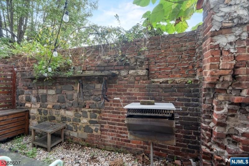 404-406 Chestnut Street Newark, NJ 07105 - Photo 7 of 27 a backyard of a house with chairs