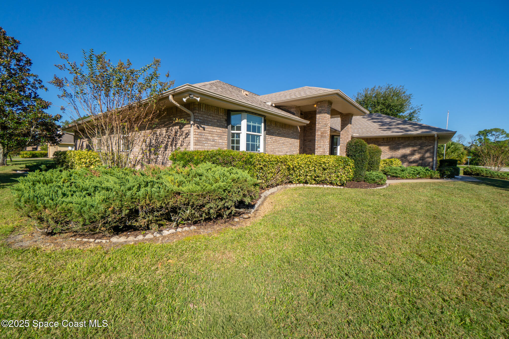 427 Hurst Road Northeast Palm Bay, FL 32907 - Photo 15 of 81 a front view of a house with a yard