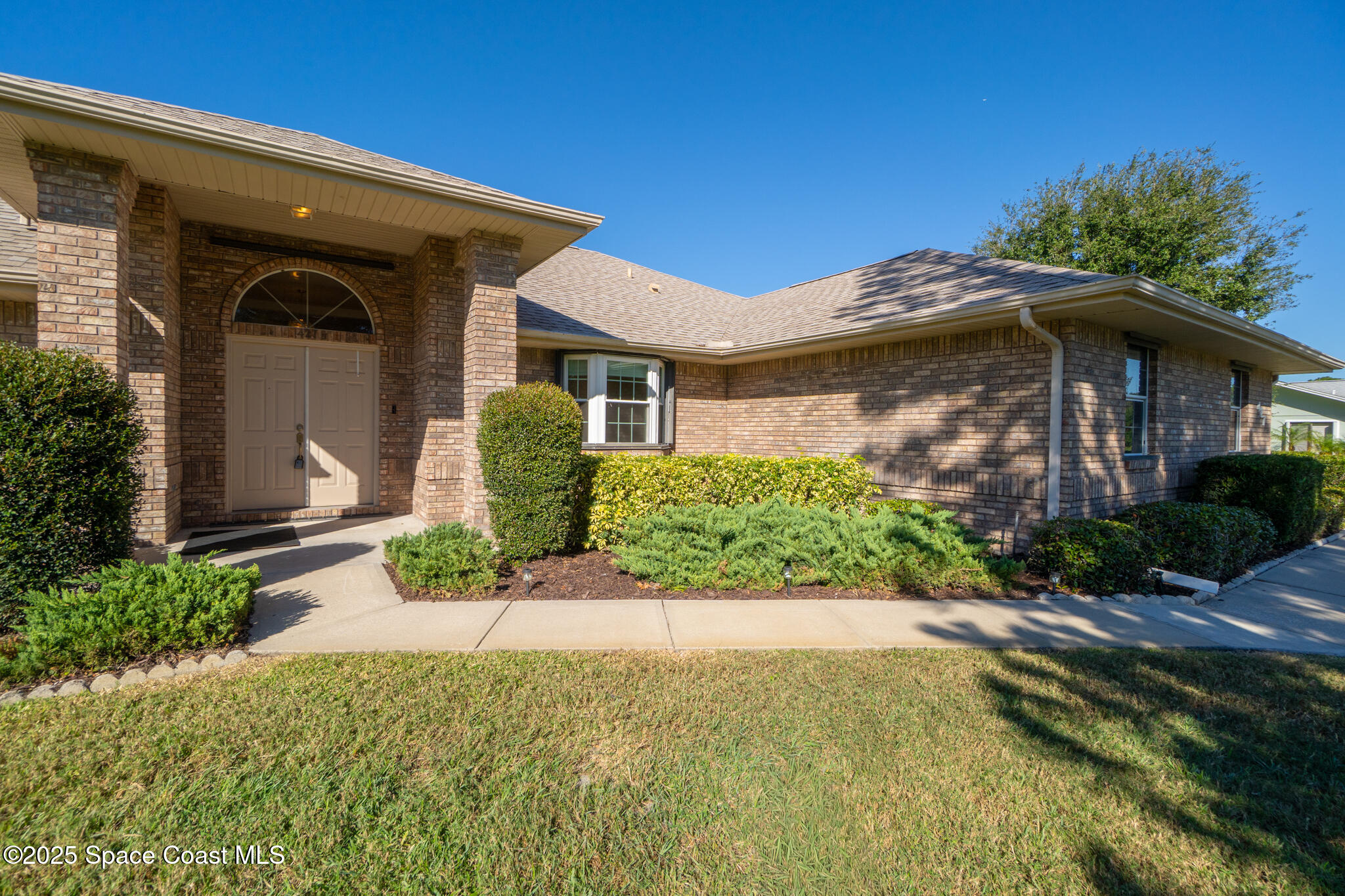 427 Hurst Road Northeast Palm Bay, FL 32907 - Photo 16 of 81 a view of a house with a yard