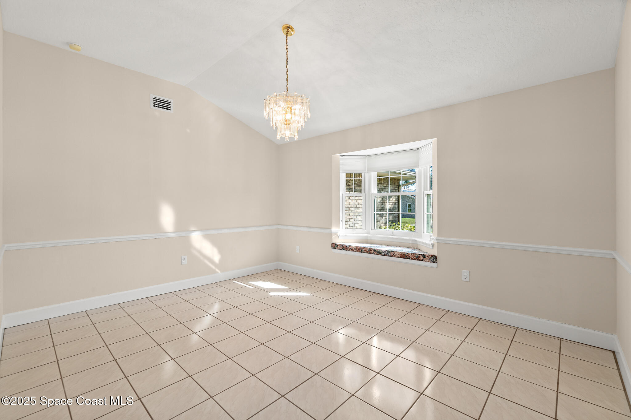 427 Hurst Road Northeast Palm Bay, FL 32907 - Photo 22 of 81 a view of an empty room with a window