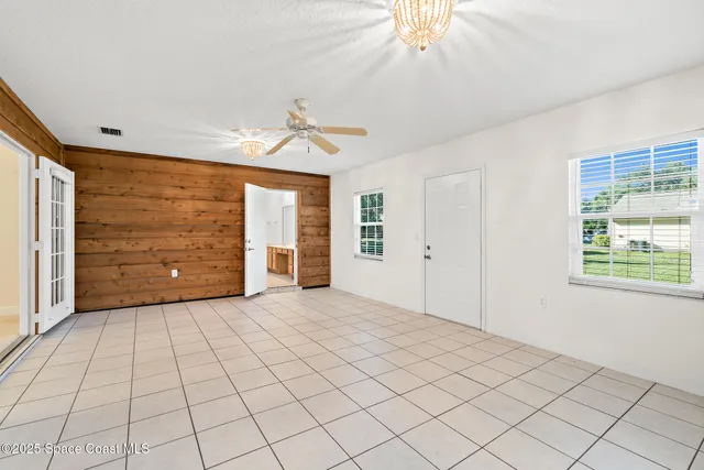 a view of a back yard of the house with a garden
