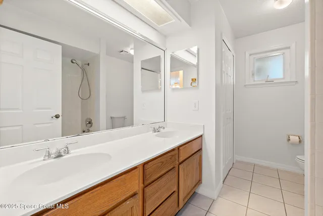 an aerial view of residential houses with outdoor space and swimming pool
