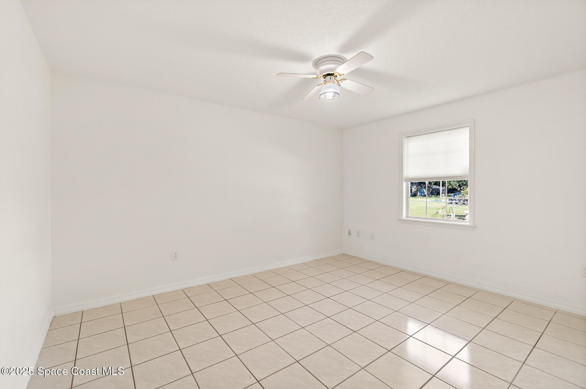 427 Hurst Road Northeast Palm Bay, FL 32907 - Photo 47 of 81 a view of an empty room and window