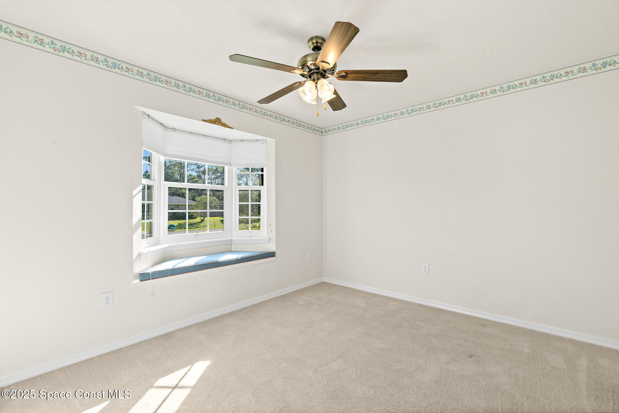 427 Hurst Road Northeast Palm Bay, FL 32907 - Photo 49 of 81 a view of an empty room with a window