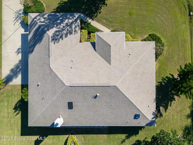 an aerial view of a house with a garden